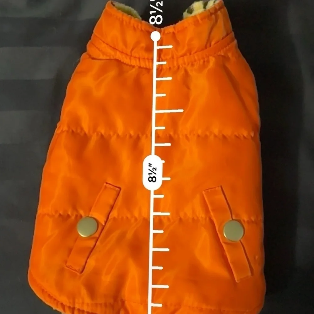 Small orange dog vest pockets are for decoration only.